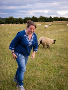 Kendra running with the sheep at the Hill of Tara in Ireland.