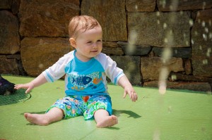 Addie enjoying the splash pool at Reedy River Park