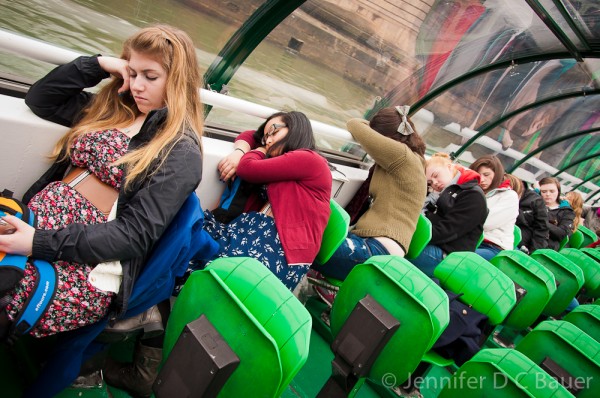 Our students asleep on a boat cruise down the Seine river in Paris, France.