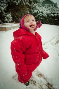 Addie catching snowflakes on her tongue.