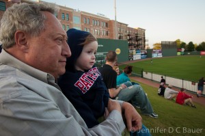 Addie and G-Dad watching the Greenville Drive.