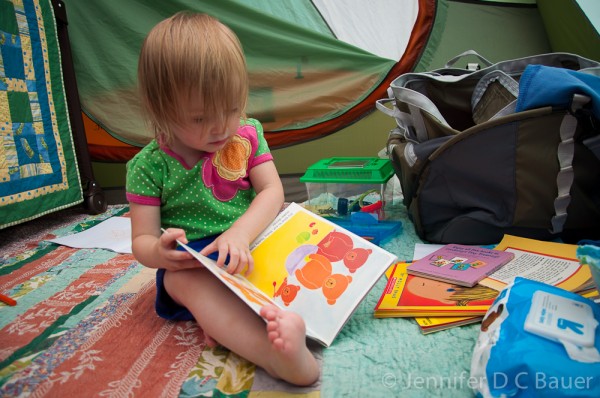 Addie reading in our tent.