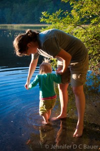 Sara helping Addie wade into Russell Pond.