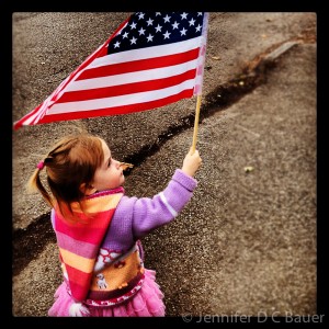 Addie waving her flag on Veteran's Day, 2012.