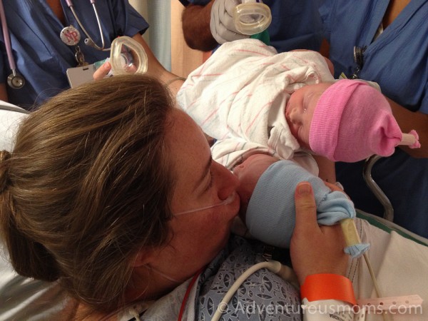 Kendra kissing the twins goodbye before they were whisked to the NICU.