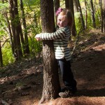 Addie tree hugging at Wilkinson Reservation in Andover, MA