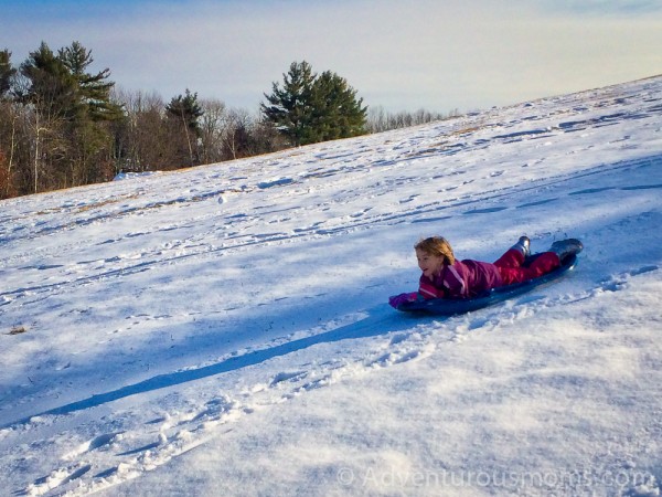 Elizabeth sledding at Carter Hill