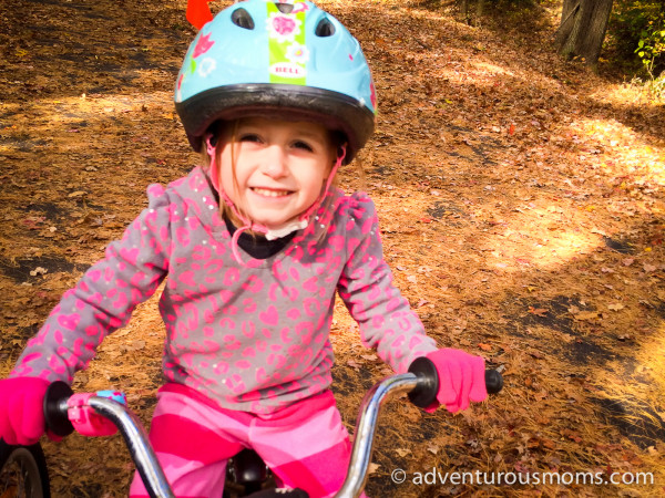 Addie on her trailer bike