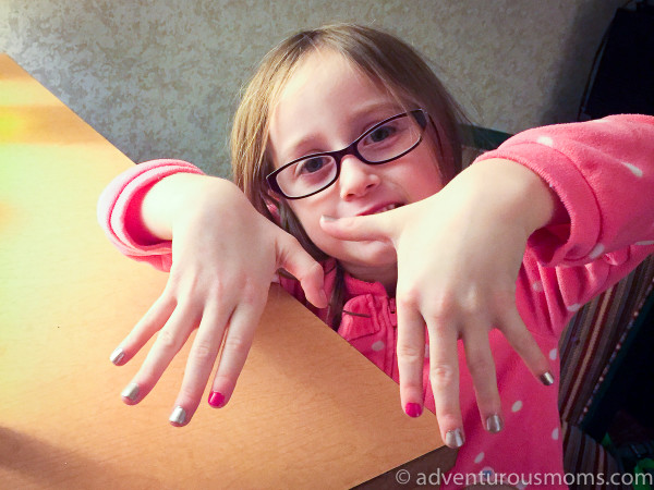 Kendra and Addie painted their nails after dinner.