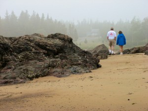 Jane and Boris walking along the shore in New Brunswick, Canada.