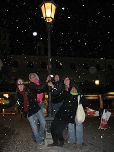 Snow falling at night in Munich, Austria.